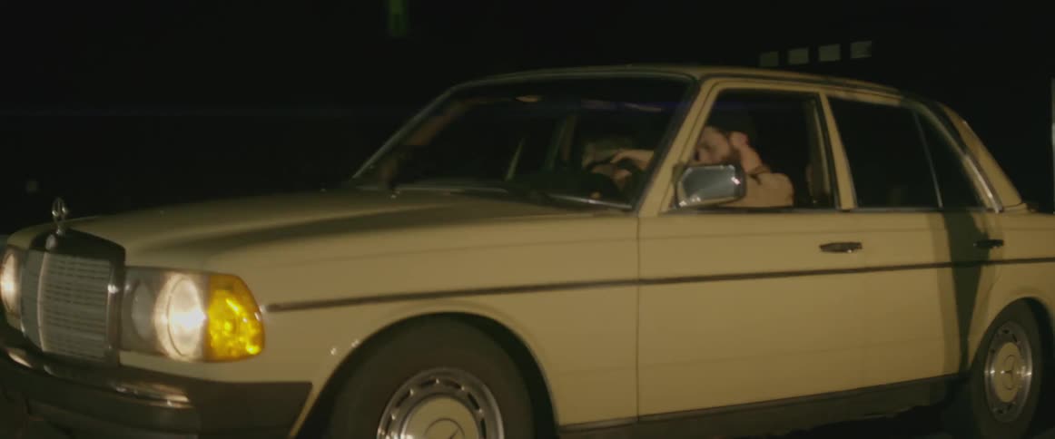 Person drives an old fashioned car at night