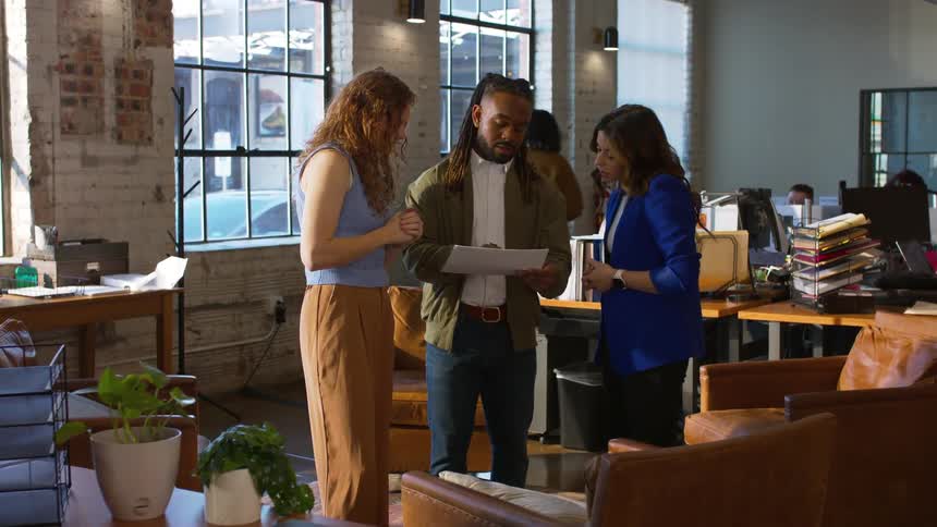 Employees are talking and working in the office