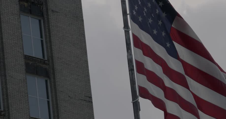 An american flag billows in the wind