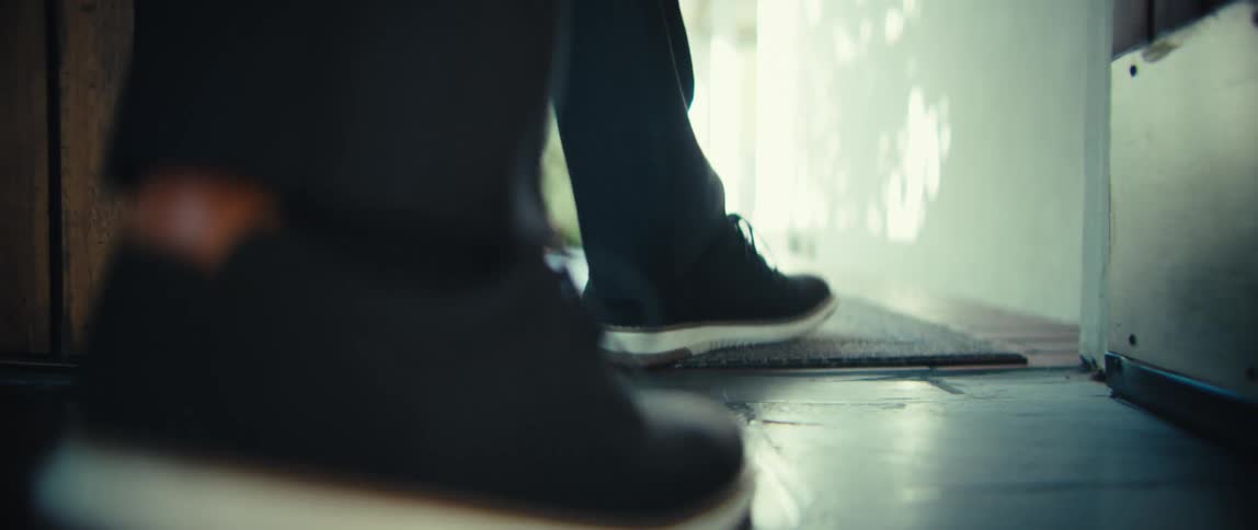Persons legs sticking out the door