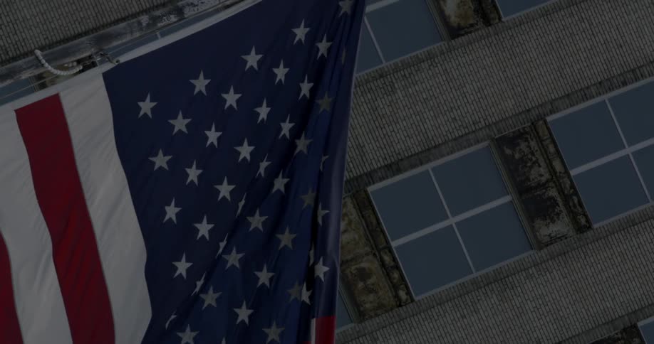American flag hanging in front of a building