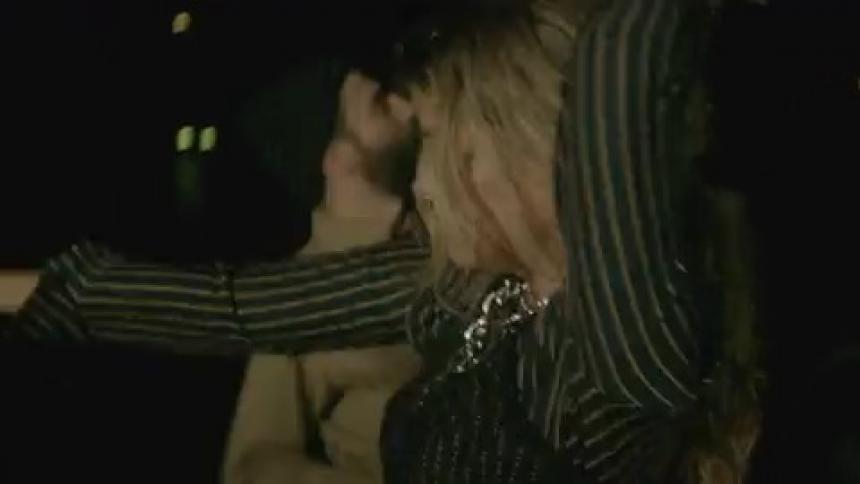 People dance outside at night together