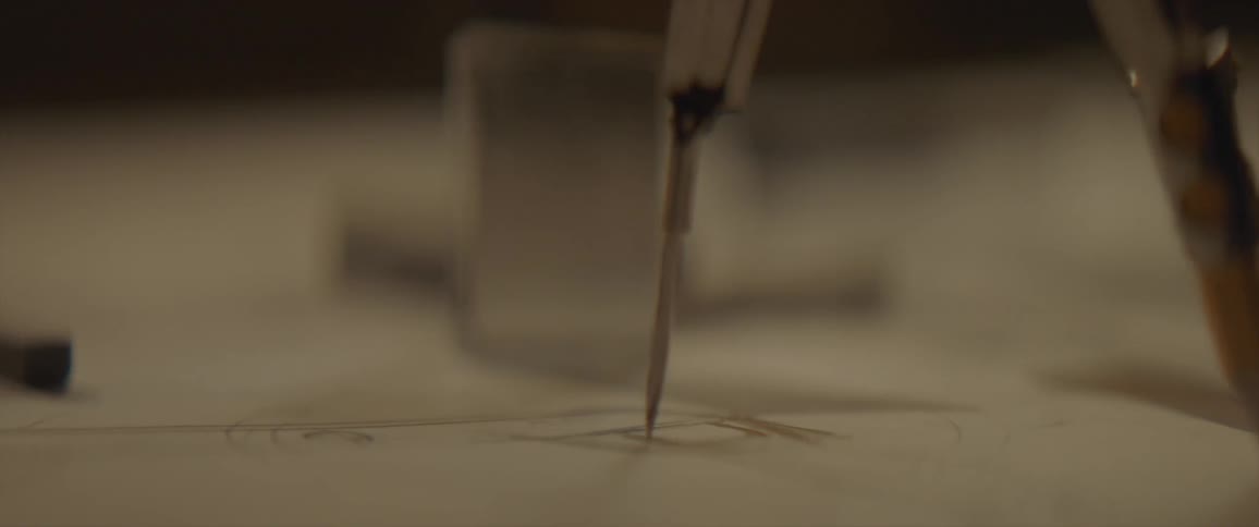 Compass twirling around on a paper