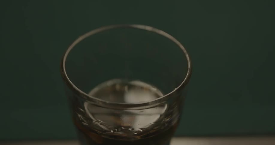 Liquid reverberates in a clear glass