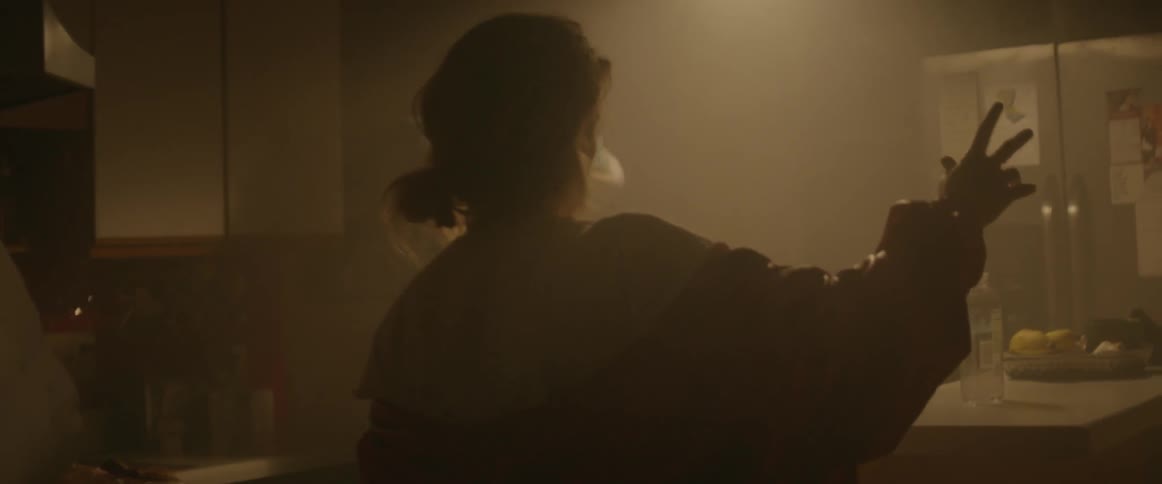 People dance inside while the lights flash