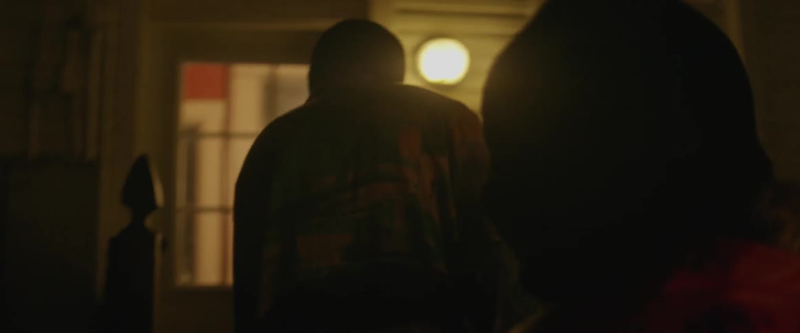 Two people wearing ski masks walk up the porch steps