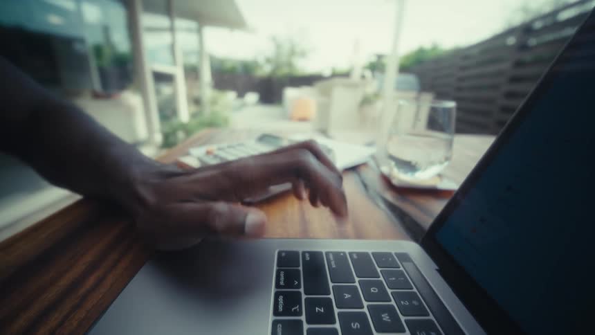Person typing on a laptop