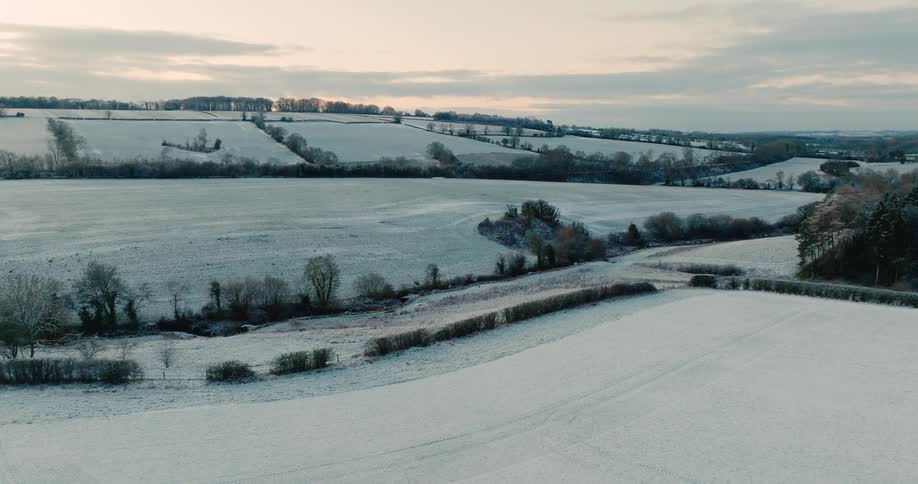 A large white field with snow on the ground