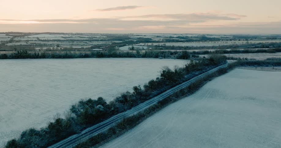 An aerial view of fields covered in snow