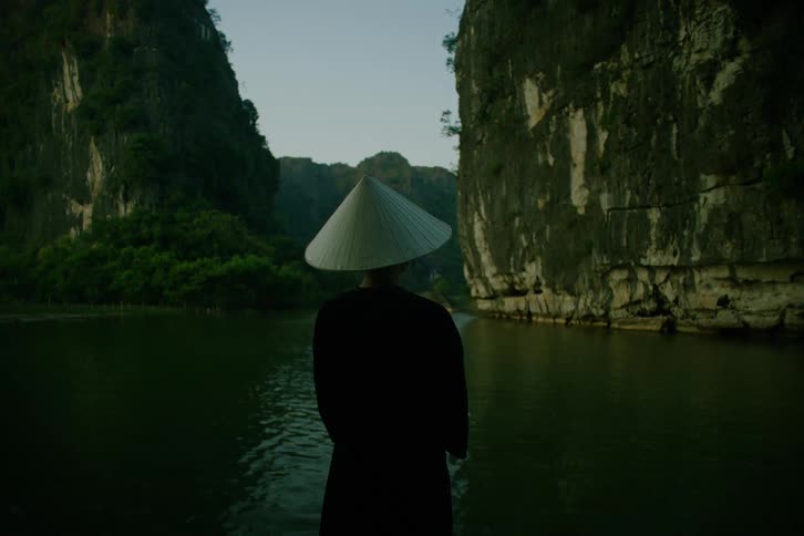 A person looking over a river in a canyon