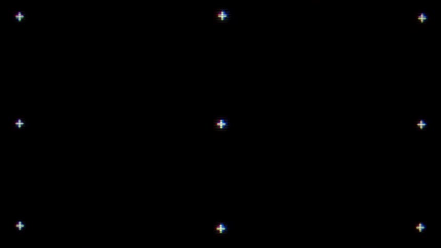 A black screen has an array of nine blinking crosses on it