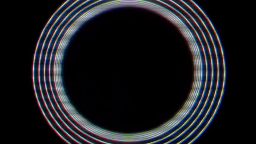 Multiple glowing concentric rings in blue and red tones expand outward from the center of a dark digital screen to create a pulsing light effect against a pitch black background