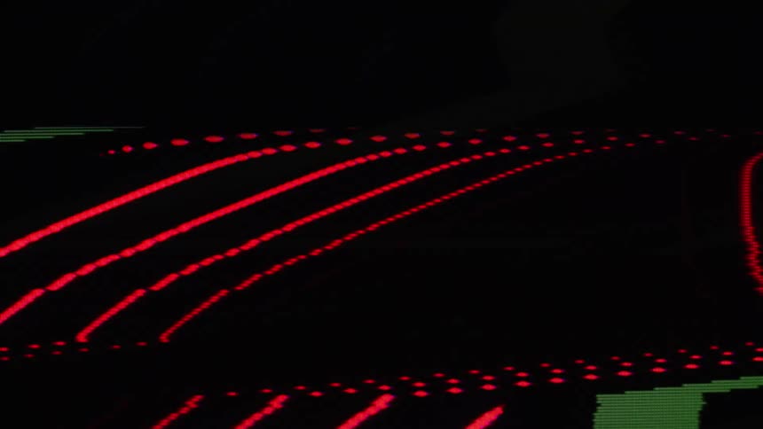 A display shows flickering and distorted lines against a black background