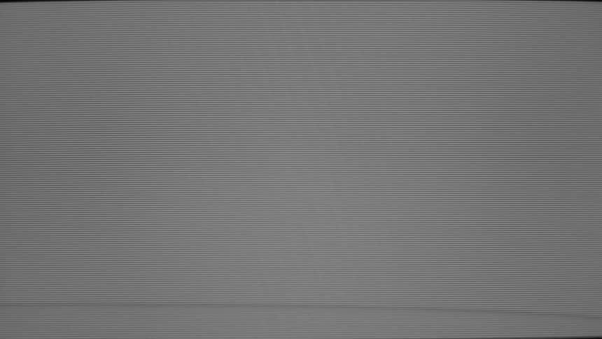 A gray analog television screen displays heavy electronic static and prominent horizontal scan lines creating a textured monochromatic field of visual noise