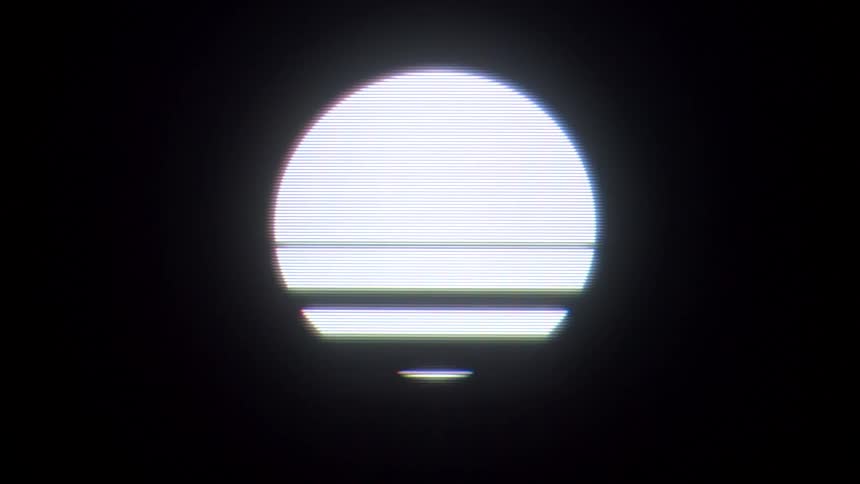The video features a stylized glowing white sun with horizontal scan lines reminiscent of a retro 1980s synthwave aesthetic it is set against a dark background and includes a translucent filmsupply watermark centered over the graphic