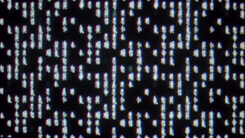 A black screen has an changing array of asian character text displayed on it