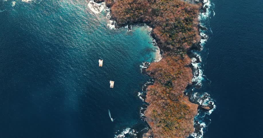 An aerial view of the coast on a sunny day