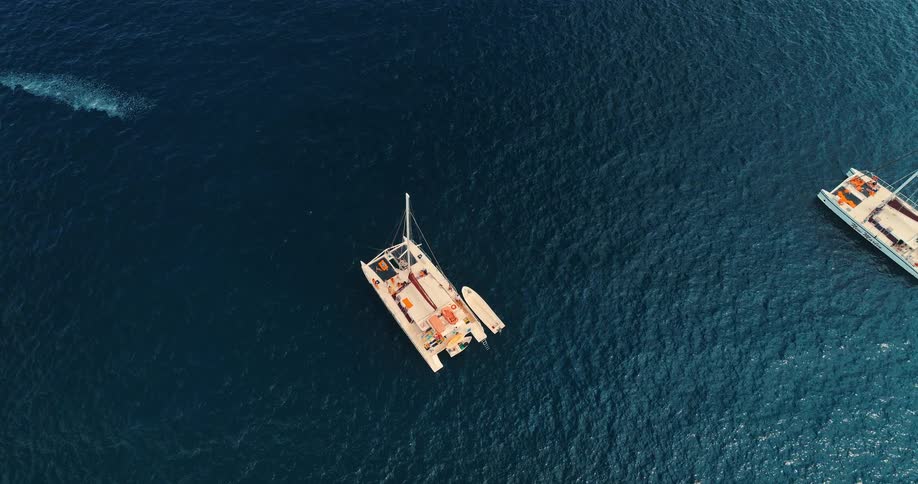 Boats are sailing in the blue water