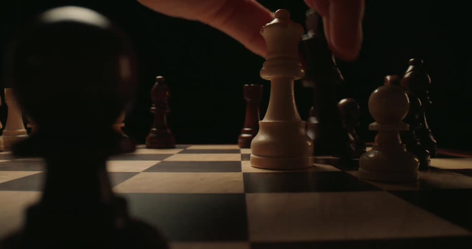 The chess piece is moved on the board