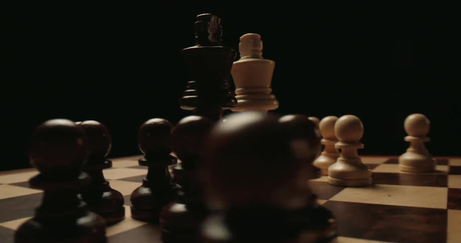 A close up of chess pieces on a board