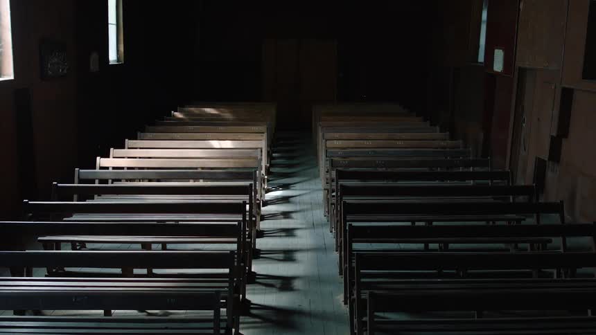 A view of some pews in a church