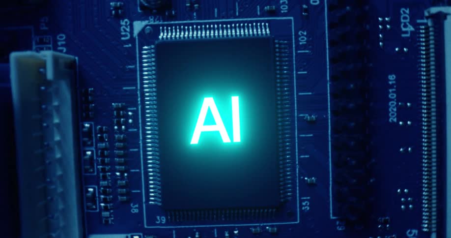 Glowing letters ai in the center of a computer motherboard surrounded by electronic components