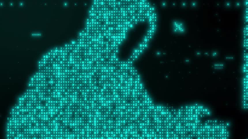 A hooded digital silhouette composed of blue glowing code and characters sits before a computer screen in a dark virtual environment