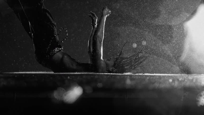 The man lands on his back in the water