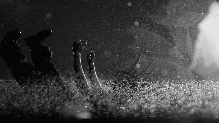 A person falling into water at night