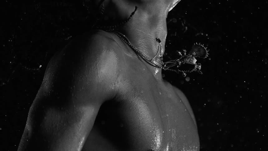 A close up of a persons chest in the rain