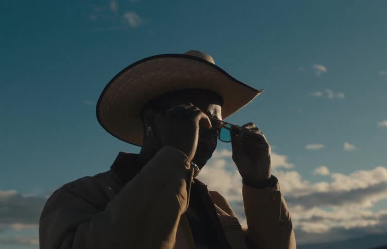 A portrait of a man standing outdoors