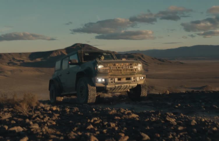 The truck is driving off road in the desert