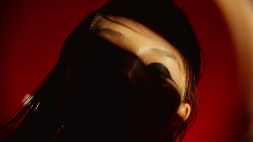The shade covers most of the womans face