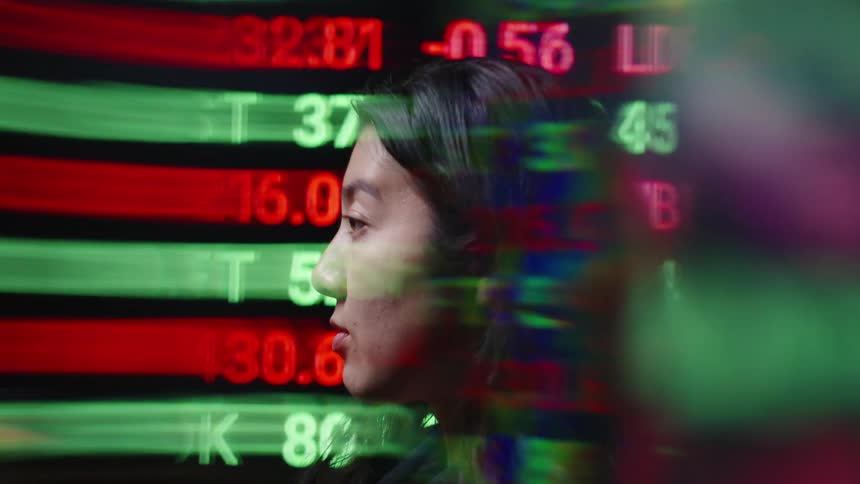 Human profile overlaid with market data in red and green