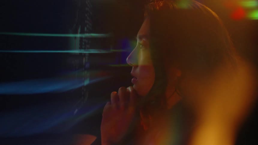 A woman looking at a computer screen
