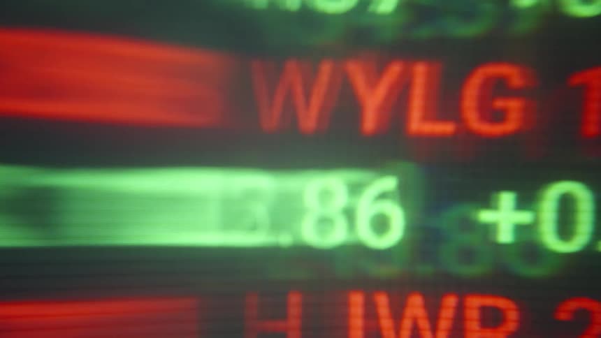 Red and green numbers and values displayed on a financial market screen