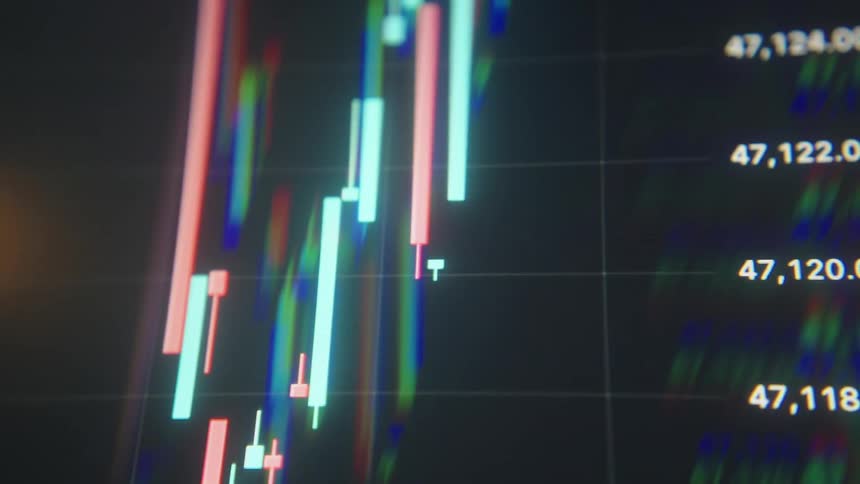Computer monitors are showing graphs and data
