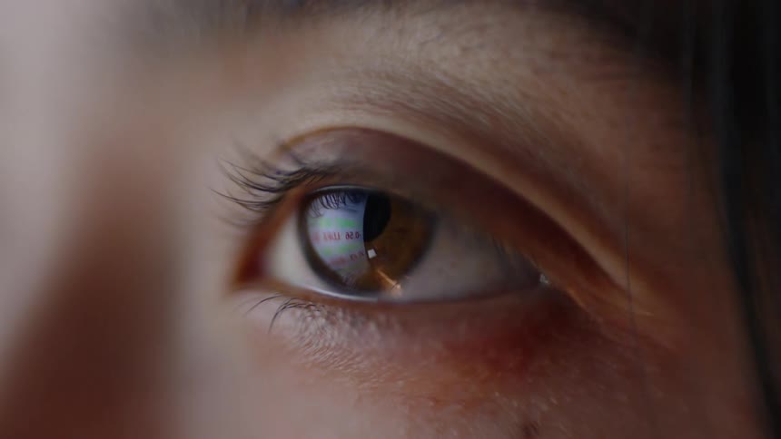 The woman is blinking her eye