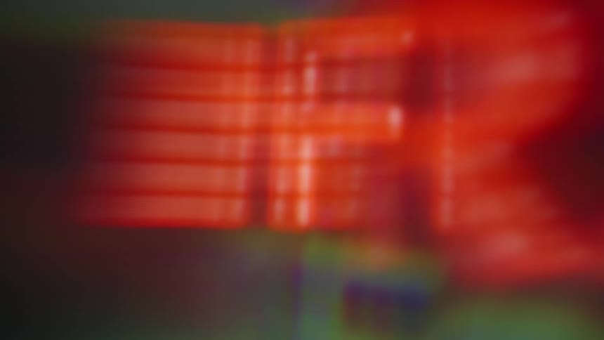 Abstract red and green light leaks with blurry distorted digital numbers move across the frame