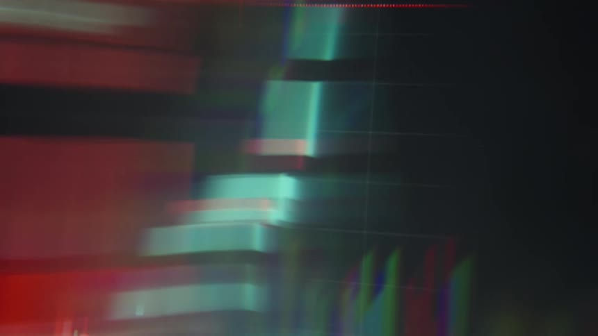 A close up of red and green lines on a graph