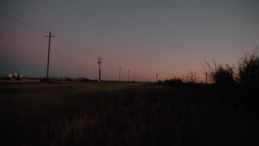 The sun is rising on the flat field