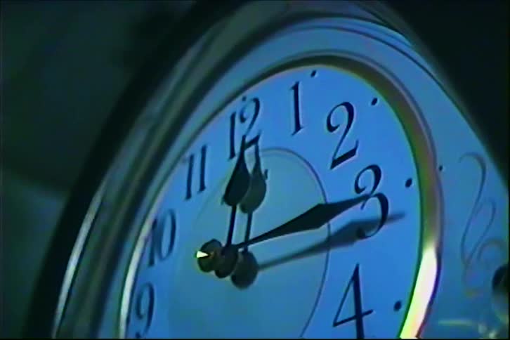 The clock sits in the dark room