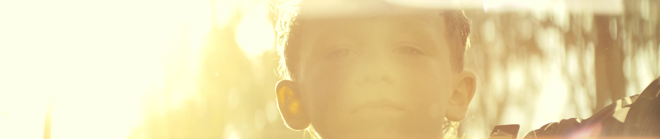 A child outdoors on a sunny day