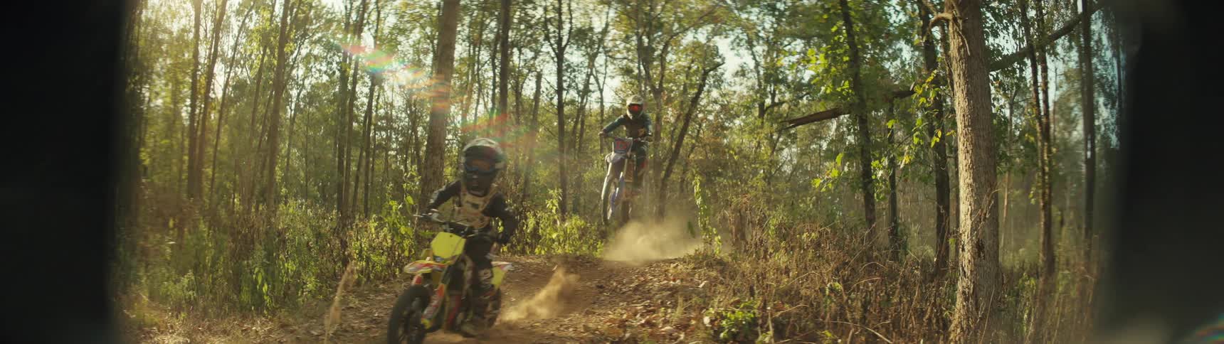 A view of two people riding dirt bikes