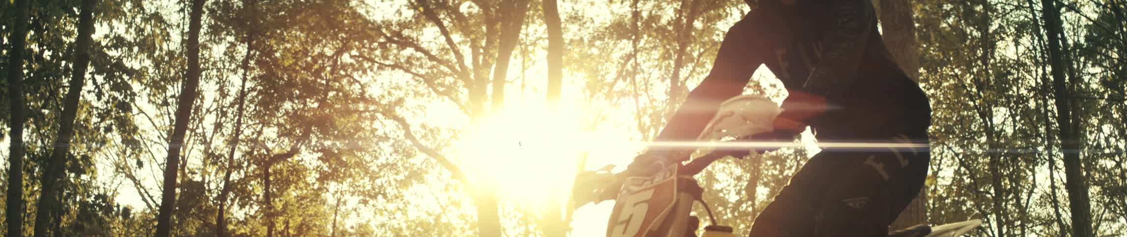 Slow motion of a person jumping a dirt bike