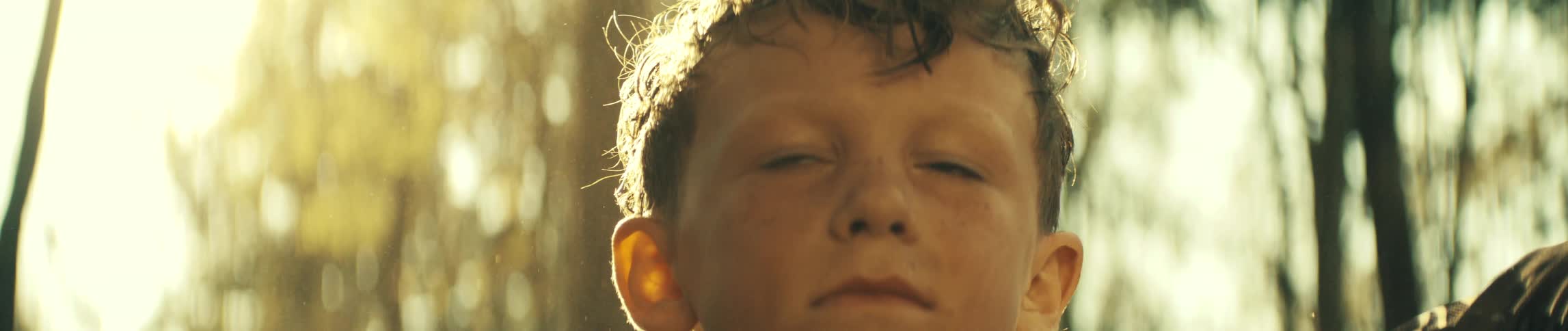 A child outdoors on a sunny dya