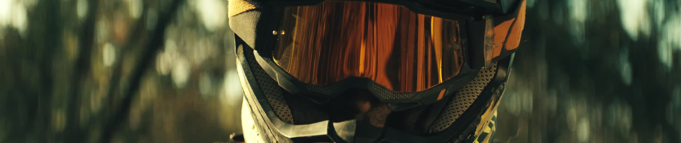 The person is wearing a crash helmet with a visor