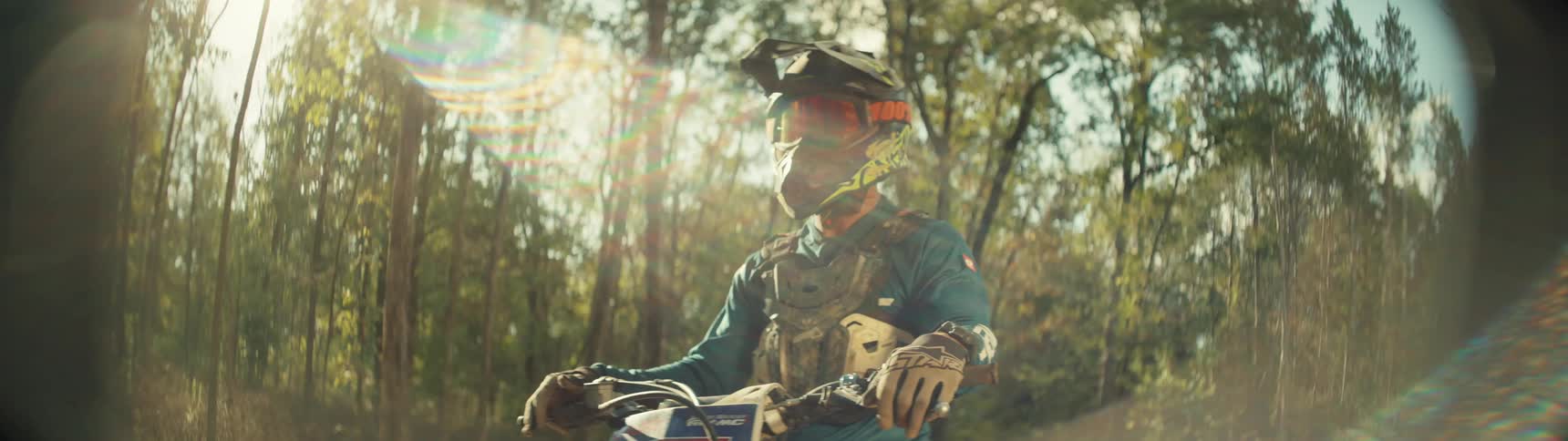 A person sitting on a dirt bike