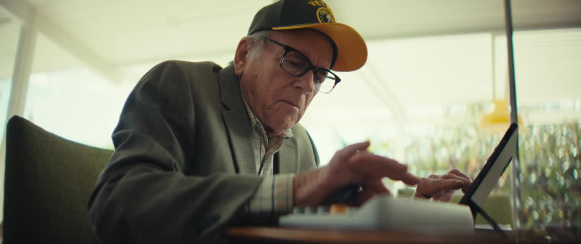 A man using a tablet in a room