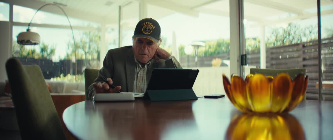 A man using a tablet in a room